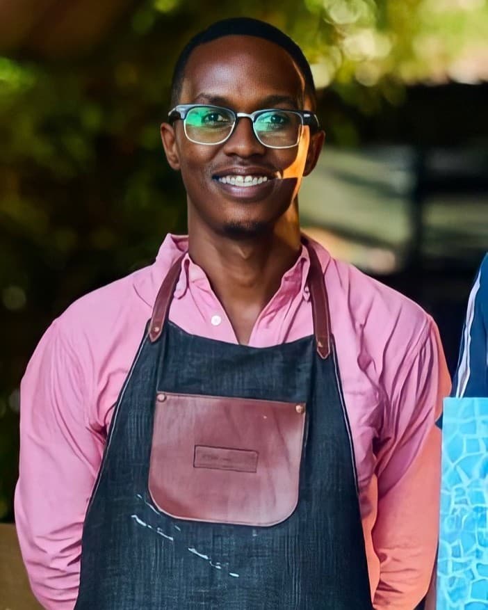 Nias Nyalada, Founder & Lead Instructor specializing in Contemporary & Abstract Art - Professional portrait showing the artist in their creative environment